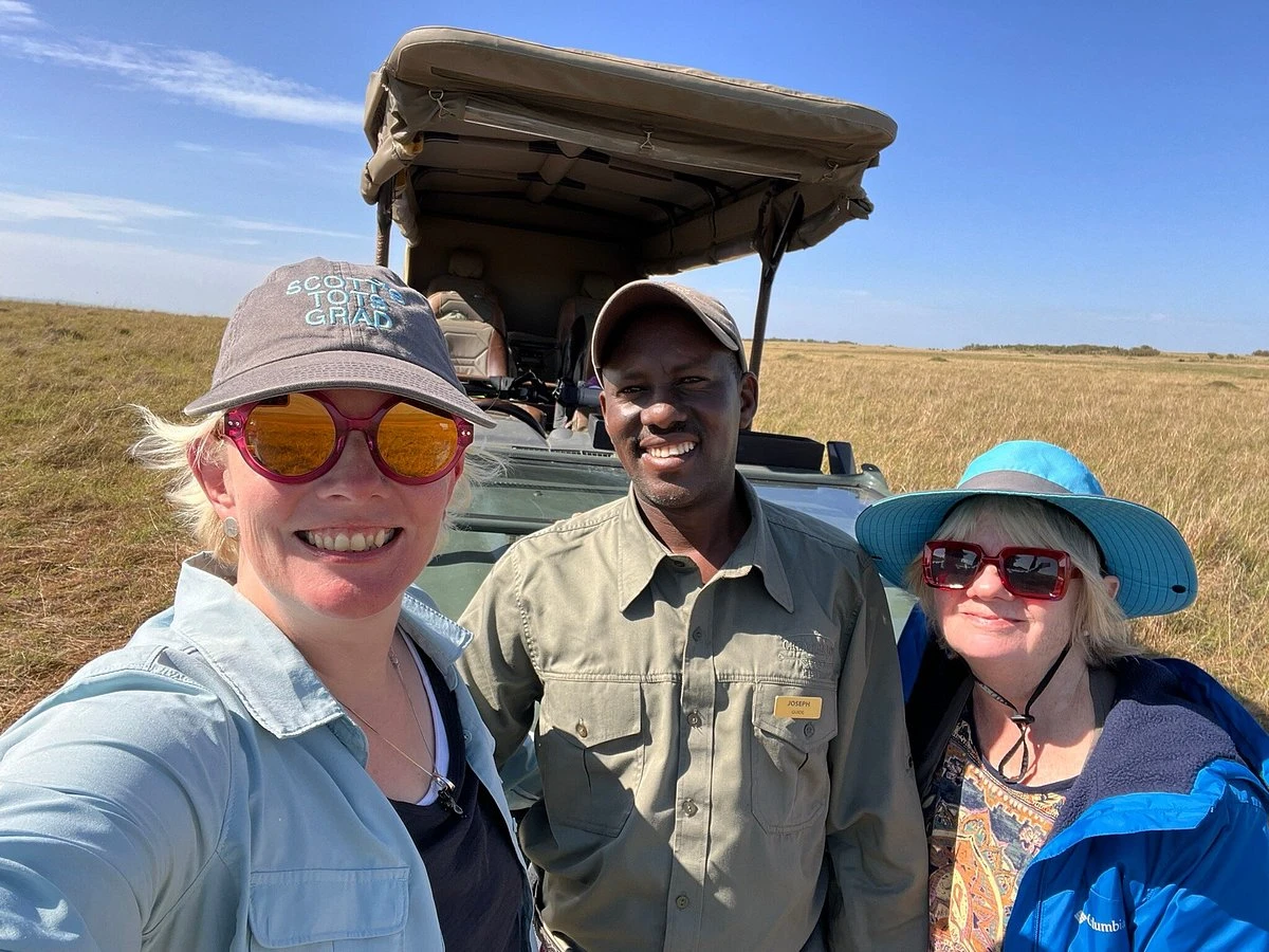 Tour Guide with guests in Mara expedition camp